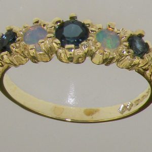 yellow gold london blue topaz and opal half eternity ring